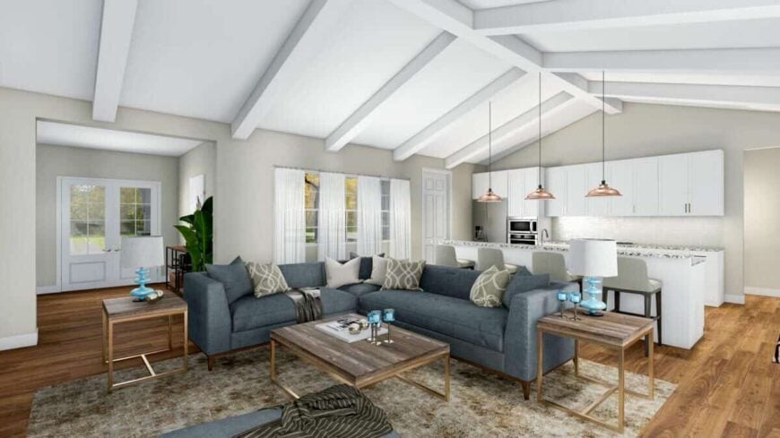 A cathedral ceiling highlighted by exposed beams runs from the great room through the kitchen.