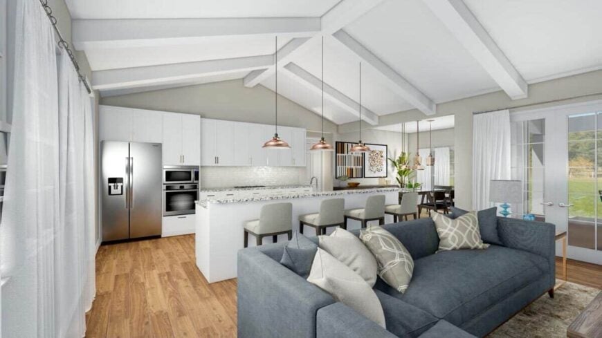 Dome pendant lights over the island illuminate the white kitchen.