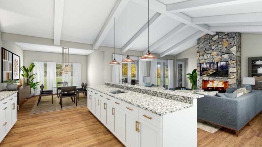 An open layout view of the kitchen, great room, and dining area with hardwood flooring.