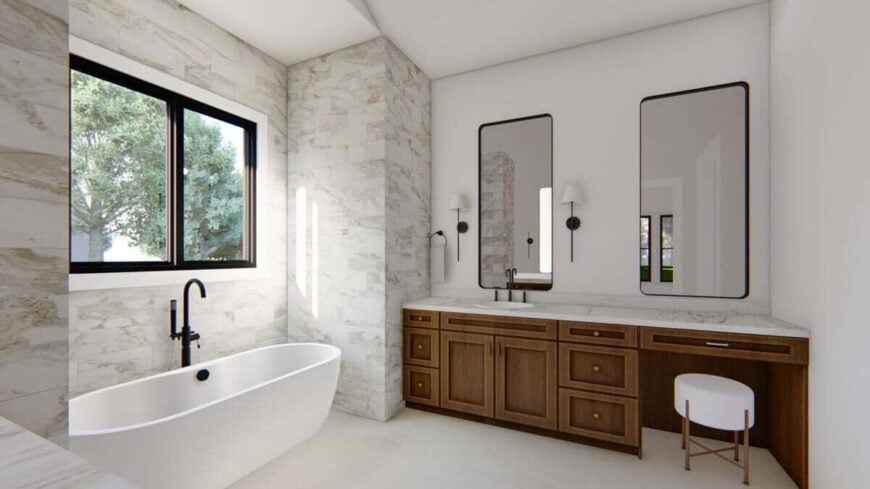 One of the vanities includes a makeup counter that's paired with a round stool.