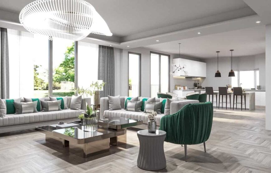 The grand room connects seamlessly to the dining area and kitchen.
