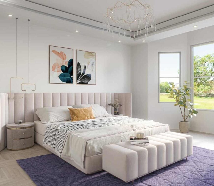 A unique crystal chandelier along with a platform bed integrated with a bespoke headboard adds elegance to the primary bedroom.