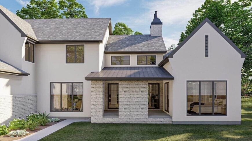 Rear rendering with a covered porch enclosed in brick walls.