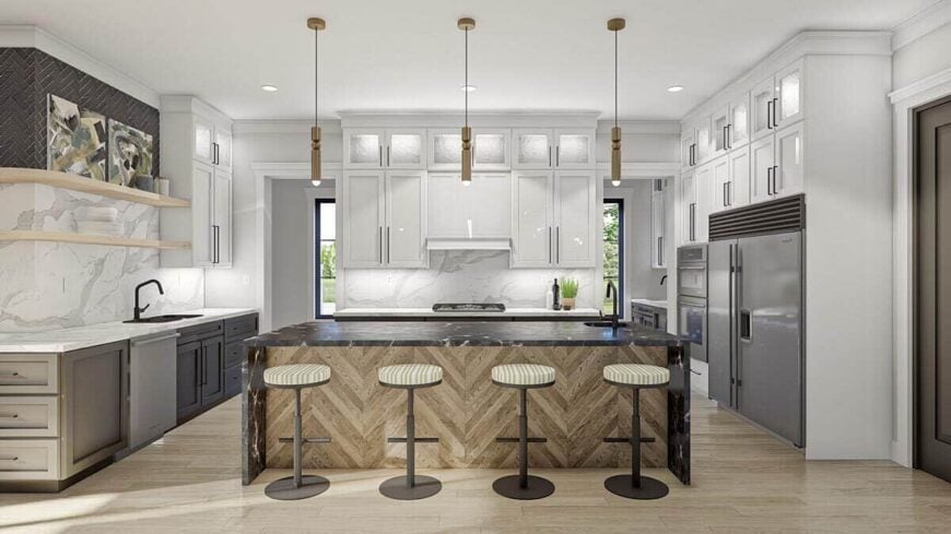 A waterfall island complemented with round bar stools and cylindrical pendants sets a nice focal point in the kitchen.