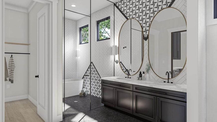 The primary bathroom has a dual sink vanity and a spacious walk-in shower with a freestanding tub.