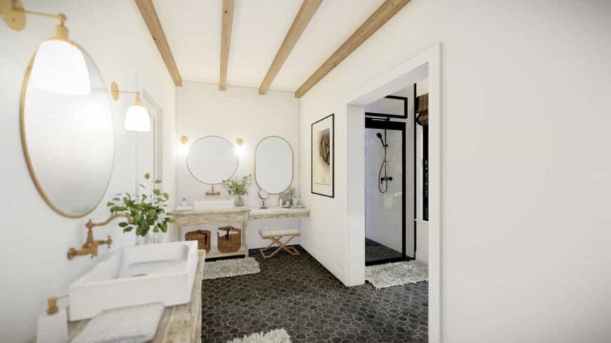 Primary bathroom with a walk-in shower, separate his and her sink vanities, and a makeup counter.