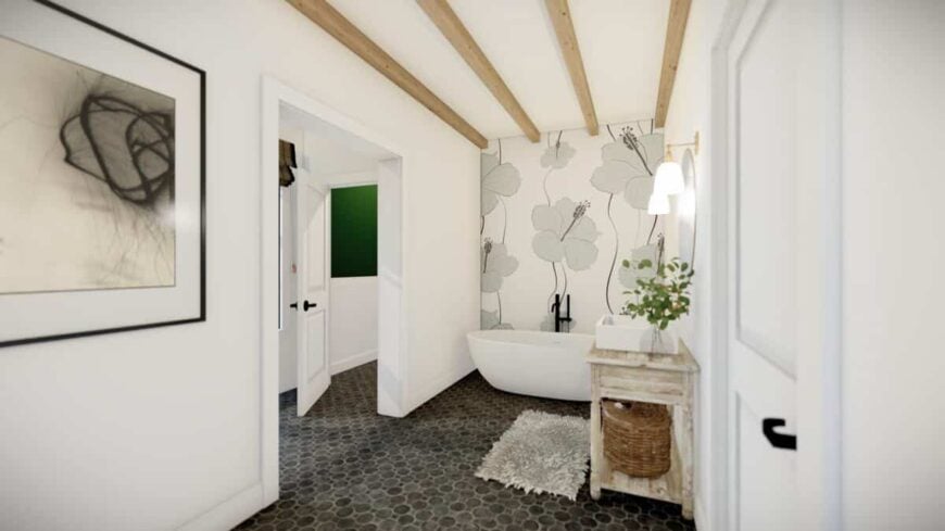 The primary bathroom includes a freestanding tub highlighted by floral wallpaper.