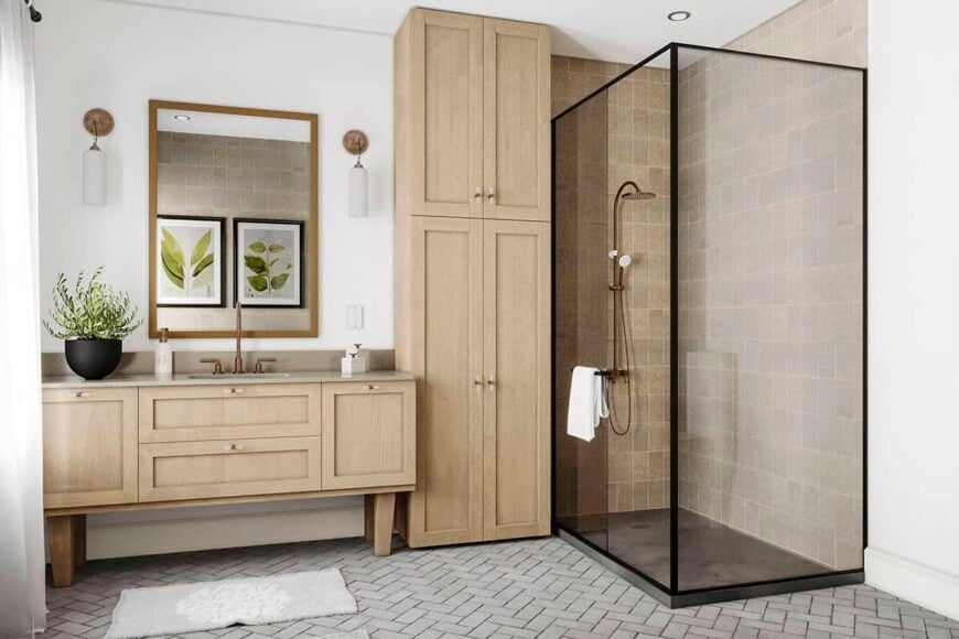 Primary bathroom with wooden vanity, a linen closet, and a walk-in shower encased in glass panels.