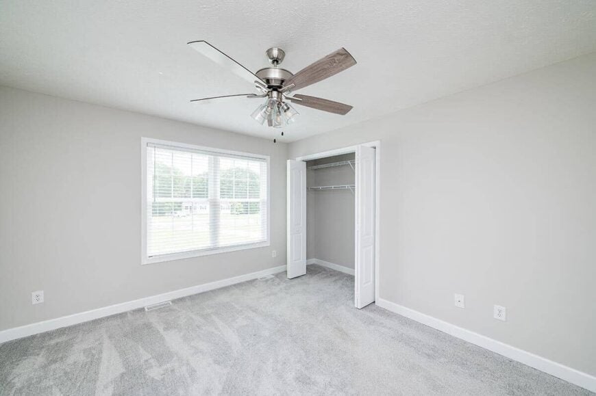 The white double doors reveal the built-in closet.