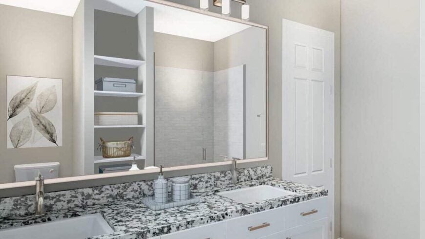 Primary bathroom with a dual sink vanity paired with a large rectangular mirror.