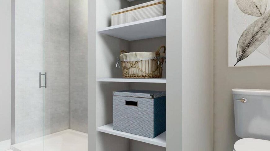 The primary bathroom includes a walk-in shower and storage shelves.