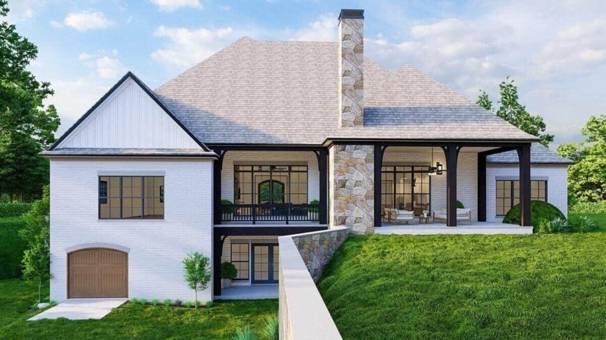 A farther view shows the walk-out basement with a covered porch.