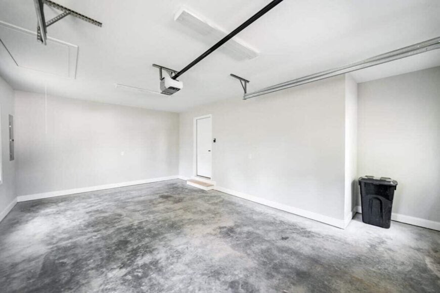 A white door connects the garage to the main home.