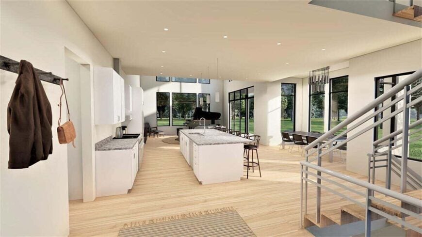 View of the combined great room, kitchen, and dining area from the foyer.