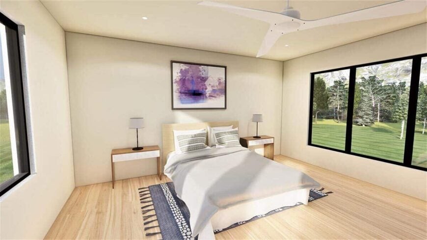 Primary bedroom with matching nightstands and a cozy wooden bed that blends in with the light hardwood floor.