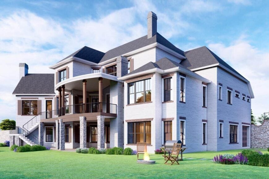 Rear rendering with covered porch and deck supported by stone pillars.