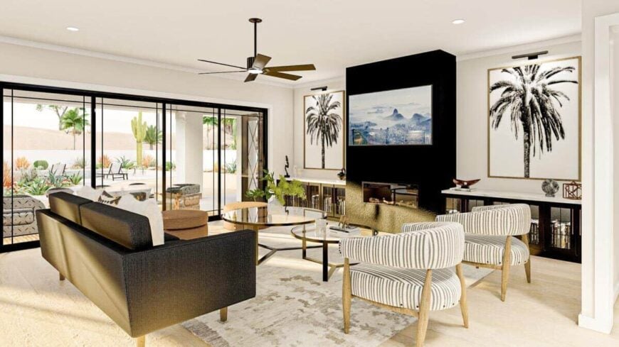 The great room has modern seats, a fireplace, and sliding glass doors that open to a covered porch.