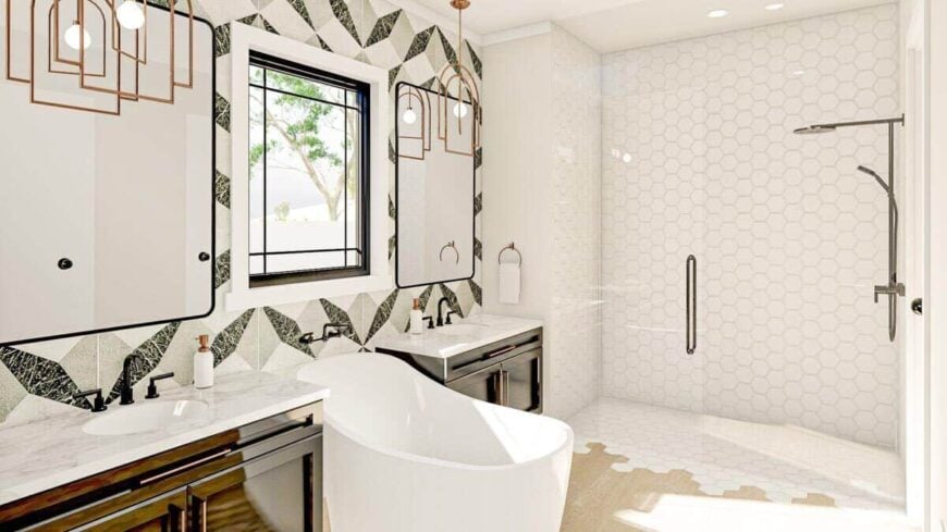 The primary bathroom features a walk-in shower and deep soaking tub flanked by his and her sink vanities.The primary bathroom features a walk-in shower and deep soaking tub flanked by his and her sink vanities.