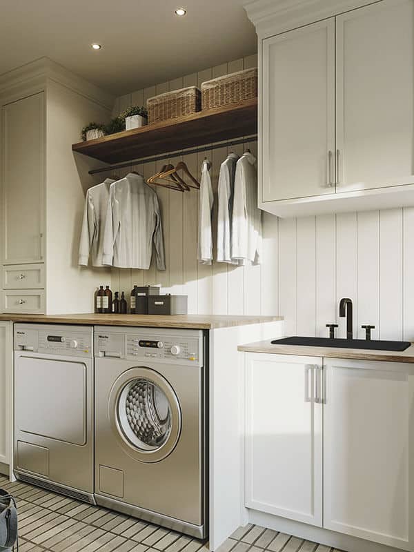 The laundry room is equipped with a washer and dryer, white cabinets, wooden countertops, and a utility sink.
