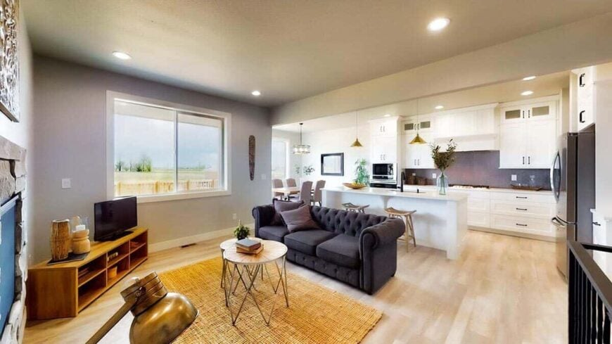 The living room opens completely to the kitchen and bright dining room.