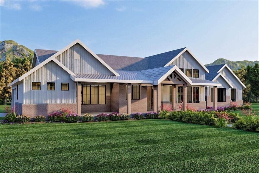 Front rendering with brick and siding, gable rooflines, and a deep covered porch framed with rustic timbers.
