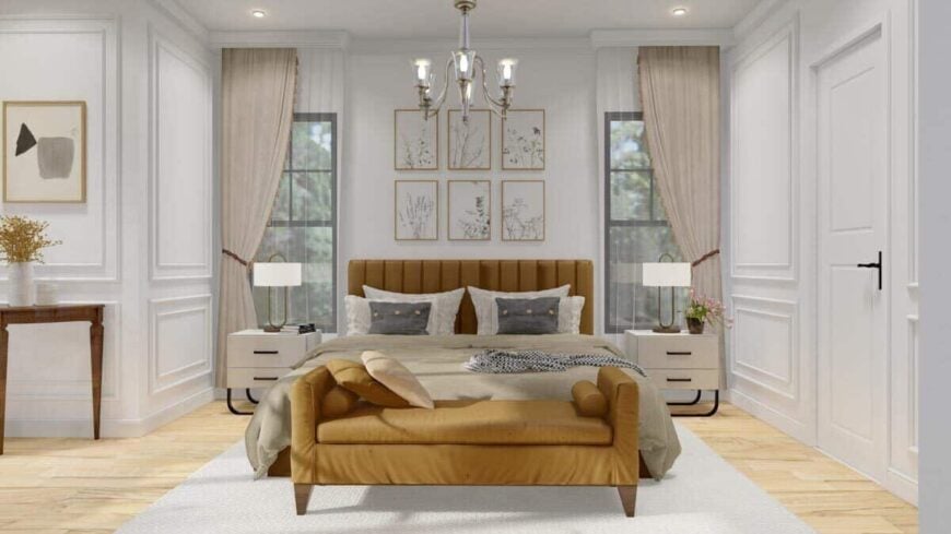 The primary bedroom features full wainscoted walls and a brown upholstered bed complemented with a matching bench.