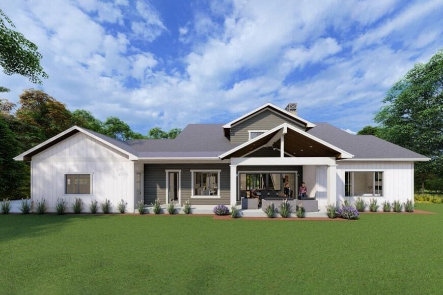 Rear rendering showcasing the covered patio and porch. Contrasting siding adds interest to the modern farmhouse.