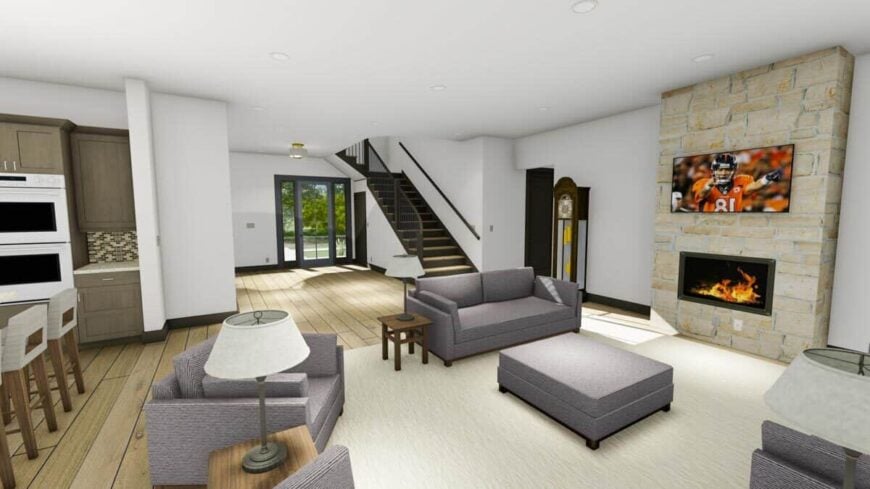 Living room with gray seats, a stone fireplace, and a wall-mounted TV.