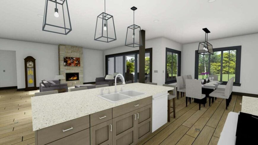 The kitchen features a center island that's fitted with double sinks. It overlooks the living room and adjoining dining area.