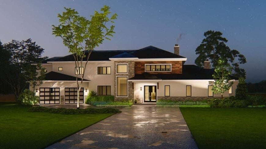 Night rendering of the modern prairie home showcasing its warm glow that complements the stone and stucco exterior.