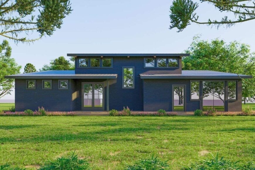 Front rendering with exposed rafter tails, a multitude of windows, and a covered entry with a french front door.