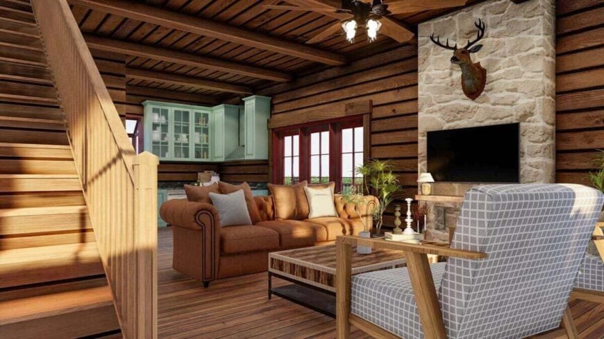 An open layout view of the living room and kitchen. A staircase on the side leads to the upstairs bedrooms.