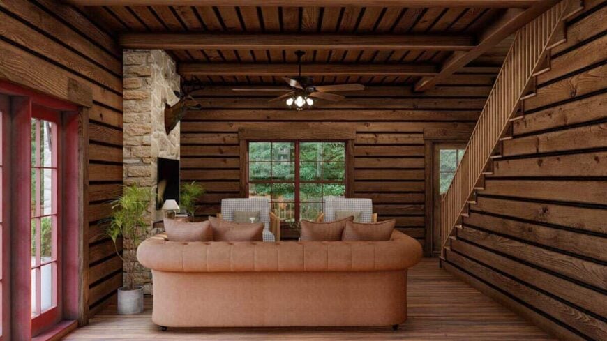 A beamed ceiling with a traditional ceiling fan crowns the living room.