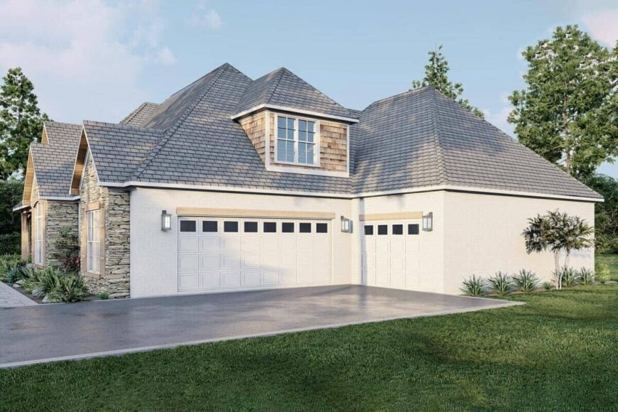 A dormer window clad in cedar shakes tops the side-loading garage.