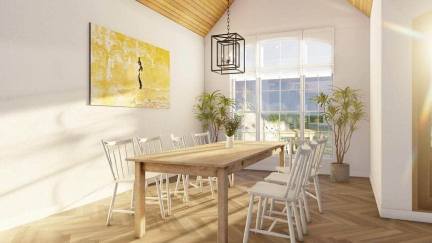 The dining area has a wooden dining set and a large window overlooking the front yard.