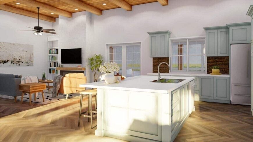 A center island fitted with a sink and dishwasher separates the kitchen from the living area.