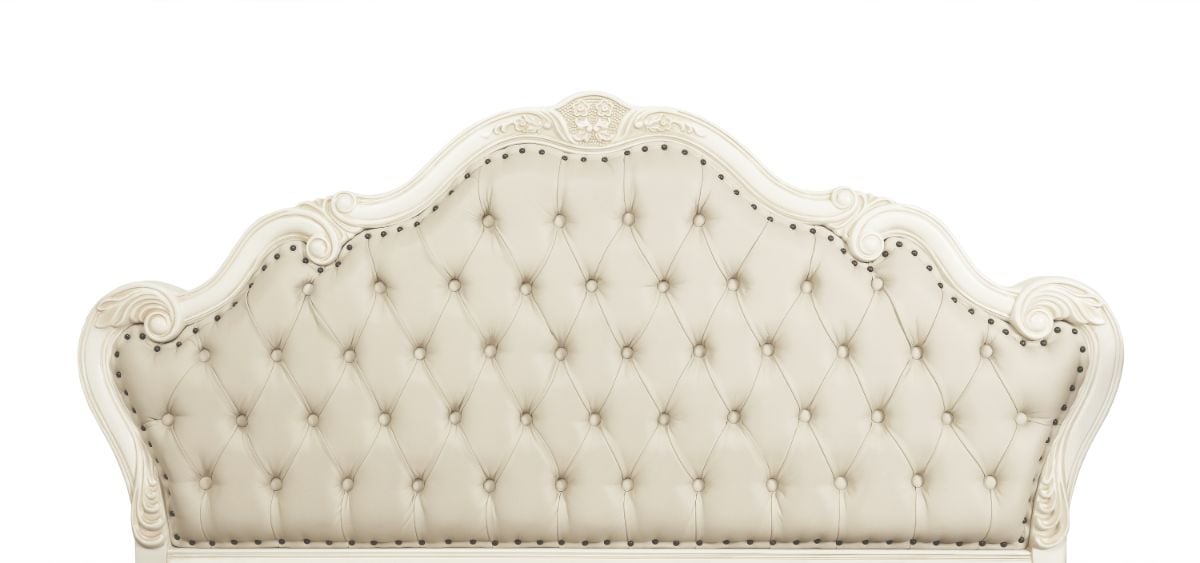 A headboard for bed with a crown design.