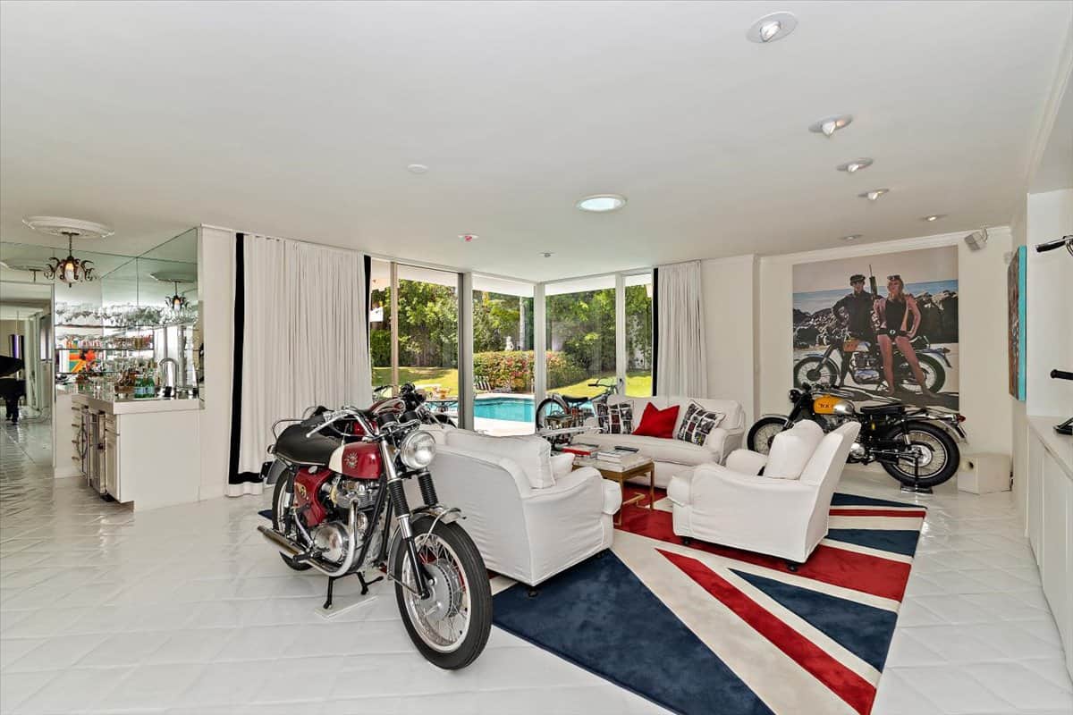 Another living space with motorcycles and a Union Jack rug. Image courtesy of Toptenrealestatedeals.com.