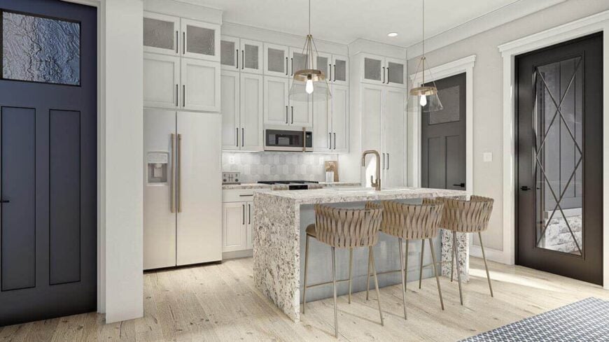 The second kitchen offers ample storage and a breakfast island with bar seating.