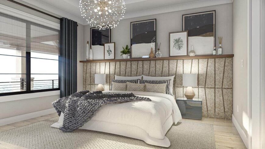 The primary bedroom features a comfy platform bed topped with framed artworks and decorative vases.