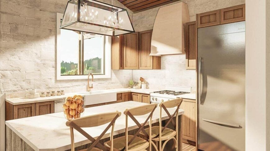 A contemporary pendant light along with wooden counter chairs complement the kitchen island.