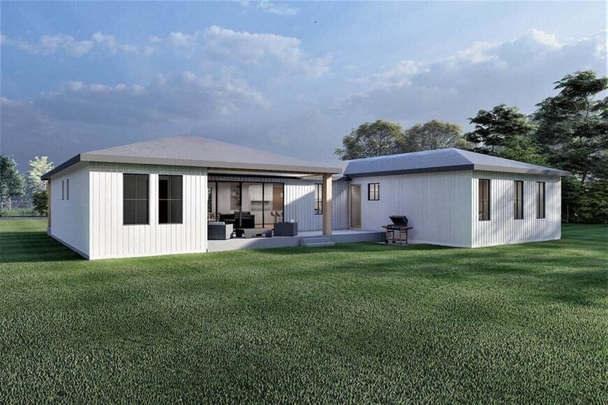 Rear rendering with a covered deck that transitions to a lush green lawn.