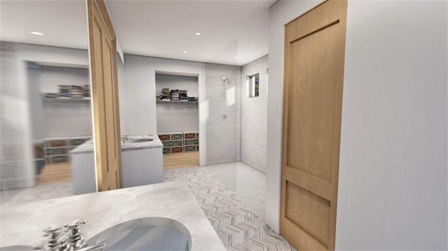 Primary bathroom with his and her sink vanities, a spacious shower area, and a walk-in closet.