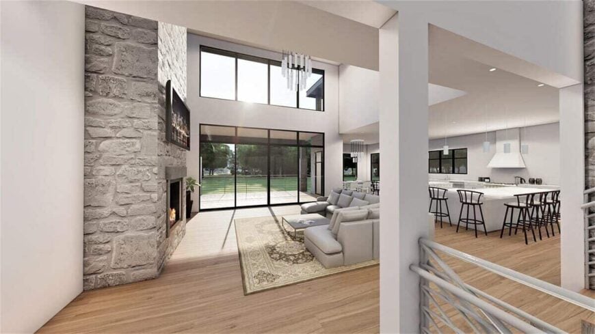 The entry has sweeping views of the open living space and the covered deck beyond.