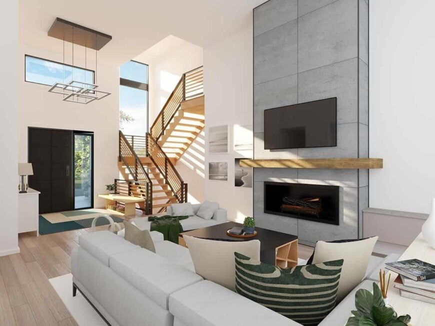 The living room includes a large fireplace topped with a wooden mantel and a wall-mounted TV.