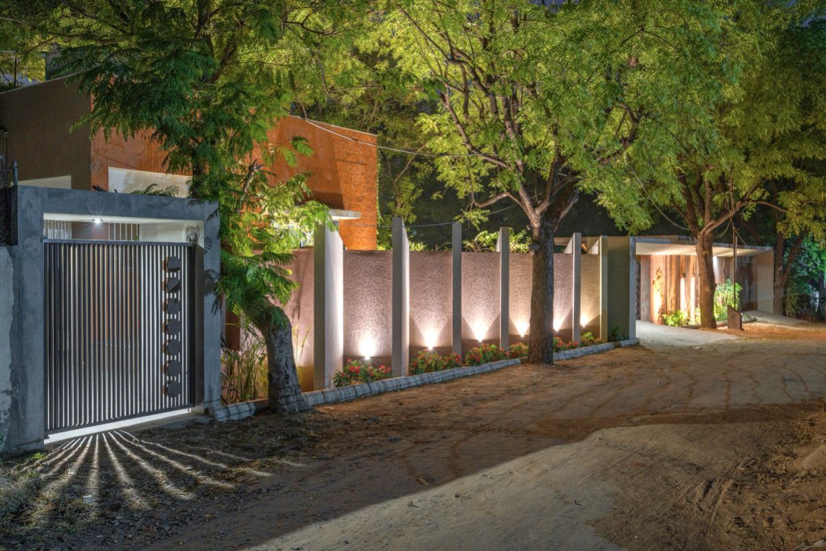 The house main gate with crafted in the envelope of brick cladded walls.