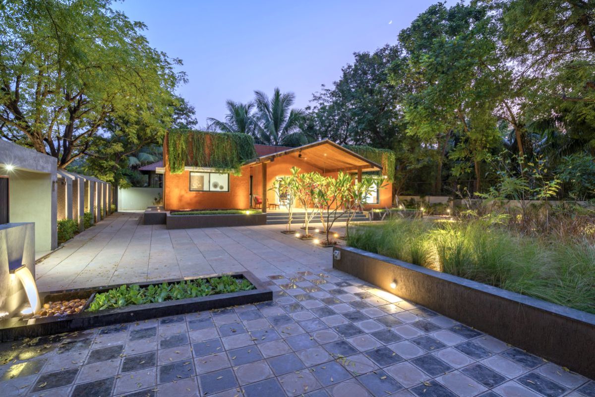 The materiality of rcc compound wall, brick cladding & rajula stone in the landscape gives the overall warm appeal to the house.