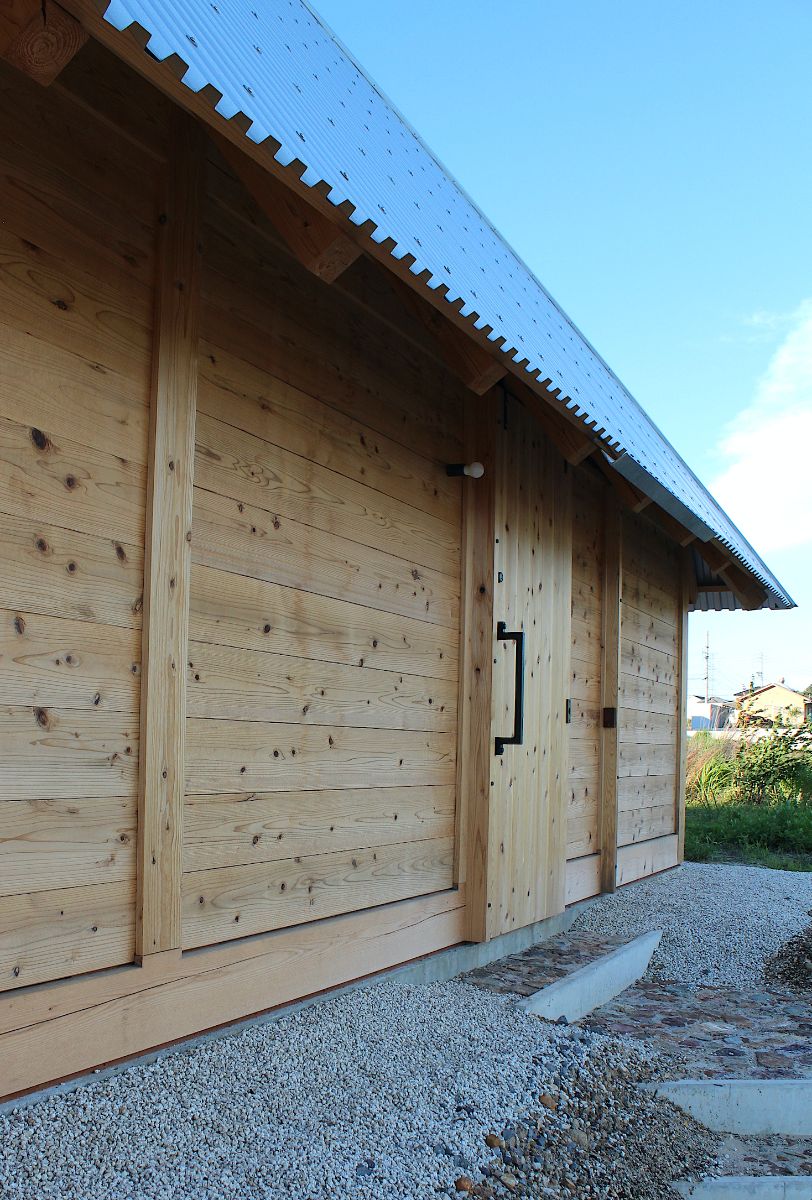 A house made of wood and steel with a slope roof.
