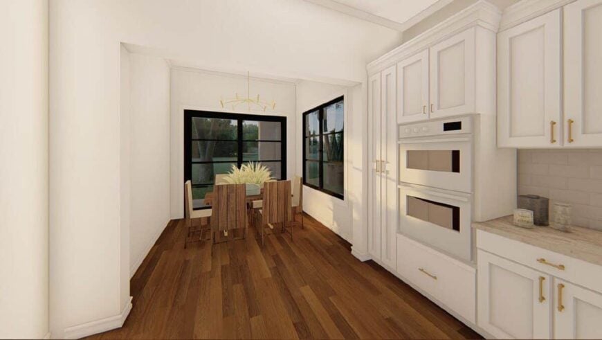 Breakfast nook with a wooden dining set and sliding glass doors that open onto the outdoor living.