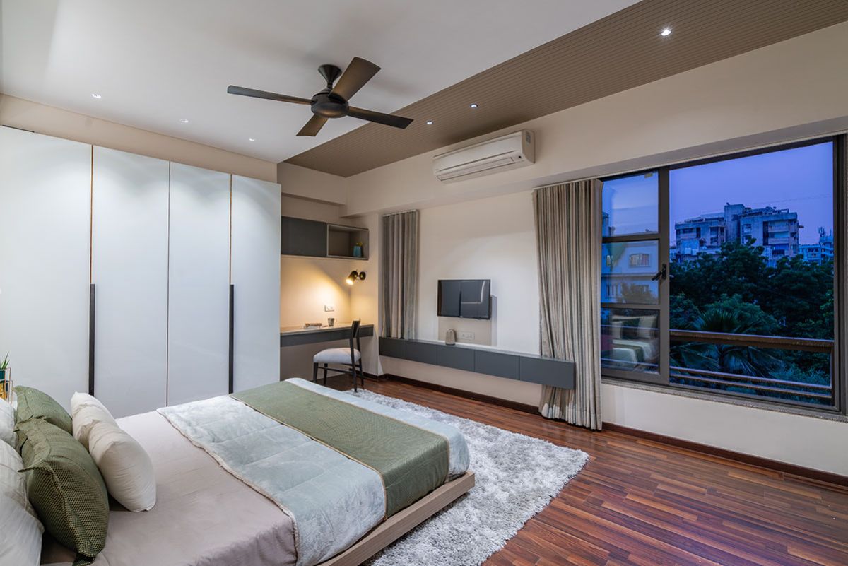 The humble sized guest-room with a views of the neighboring buildings.